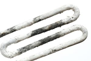 isolated spoiled washing machine heater with limescale